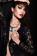 sexy stylish brunette model with bright makeup, with red lips