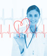 Doctor holding stethoscope up to ECG line