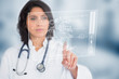 Photo: Calm doctor touching a medical interface Calm doctor touching a medical interface