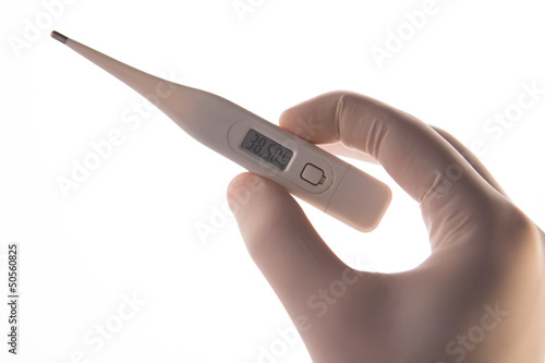 Photo: Gloved hand holding digital thermometer Gloved hand holding digital thermometer