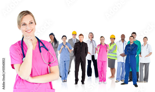Photo: Nurse standing in front of different types of workers Nurse standing in front of different types of workers