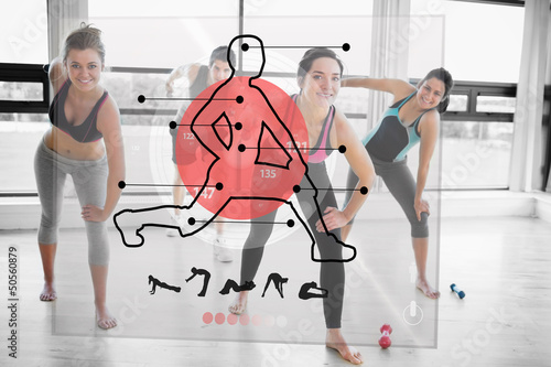 Photo: Women doing exercise with futuristic red interface demonstration Women doing exercise with futuristic red interface demonstration