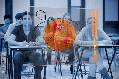 Photo: Classmates concentrated on futuristic interface with brain Classmates concentrated on futuristic interface with brain