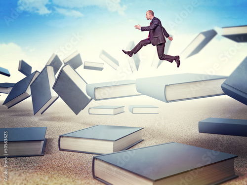 Photo: man on books man on books