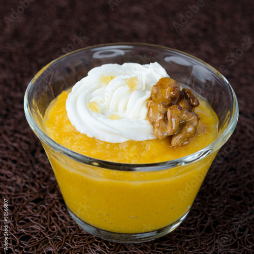 Photo: pudding with pumpkin and mango in a glass beaker pudding with pumpkin and mango in a glass beaker