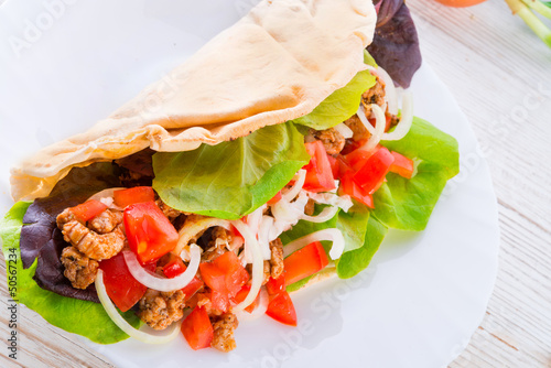 Photo: Kebab - grilled meat, bread and vegetables Kebab - grilled meat, bread and vegetables
