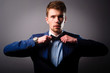 Portrait of handsome stylish man in elegant blue suit