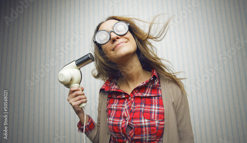 Photo: Nerdy woman drying hair Nerdy woman drying hair