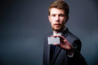 Business man handing a blank business card