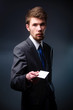 Business man handing a blank business card