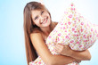 Foto: Girl holding pillow Girl holding pillow