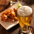 Photo: beer and chicken wings close up beer and chicken wings close up