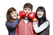 Teenage siblings fighting with boxing gloves