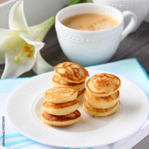 Photo: Freshly baked poffertjes - traditional Dutch little pancakes Freshly baked poffertjes - traditional Dutch little pancakes