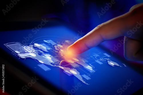 Photo: Closeup of finger touching tablet-pc screen Closeup of finger touching tablet-pc screen