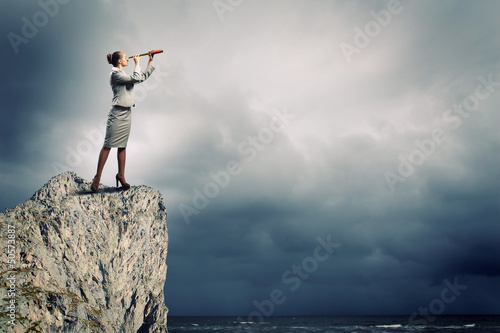 Photo: Business woman with telescope Business woman with telescope