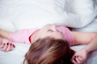 blonde girl pink pyjamas in bed