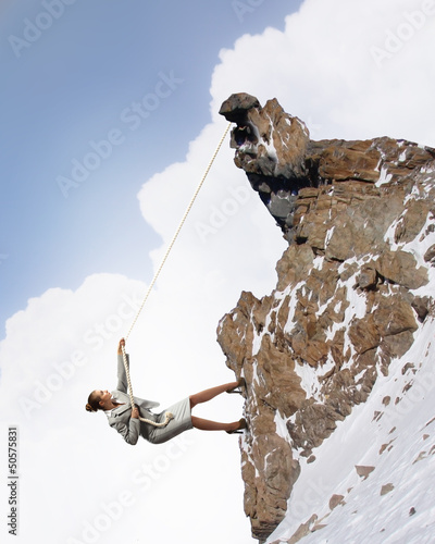 Photo: businesswoman climbing mountain businesswoman climbing mountain