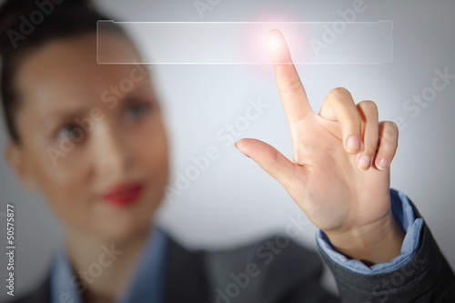 Photo: Business woman touching display Business woman touching display