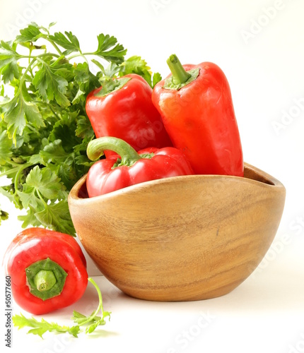 Photo: Fresh ripe red bell paprika peppers and parsley Fresh ripe red bell paprika peppers and parsley