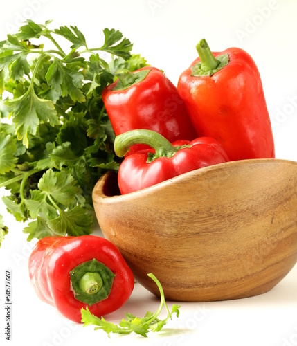 Photo: Fresh ripe red bell paprika peppers and parsley Fresh ripe red bell paprika peppers and parsley