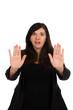 Woman with red eyes holds up her hands