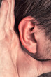 Closeup for hand on ear