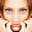 Portrait of a young woman with beautiful hair and blue eyes