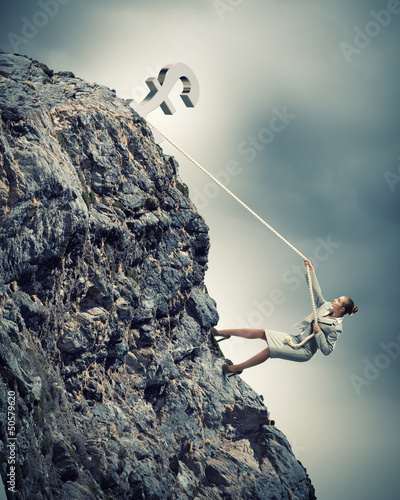 Photo: businesswoman climbing mountain businesswoman climbing mountain