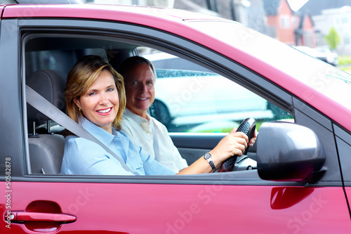 Photo: Happy senior couple in the car. Happy senior couple in the car.