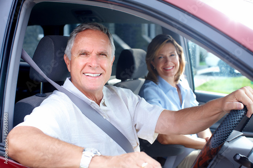 Photo: Happy senior couple in the car. Happy senior couple in the car.
