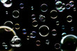 Colorful soap bubbles isolated on black background