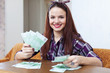 happy housewife with many euro
