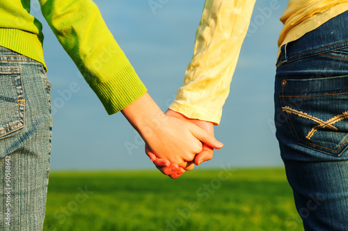 Photo: Teen girls holding hands Teen girls holding hands