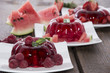 Red Jello on wooden background