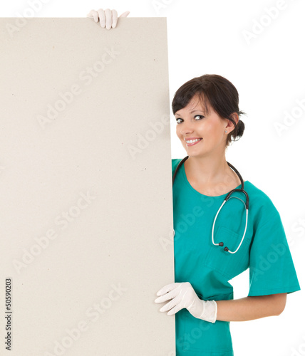 Photo: female doctor keeping blank billboard female doctor keeping blank billboard