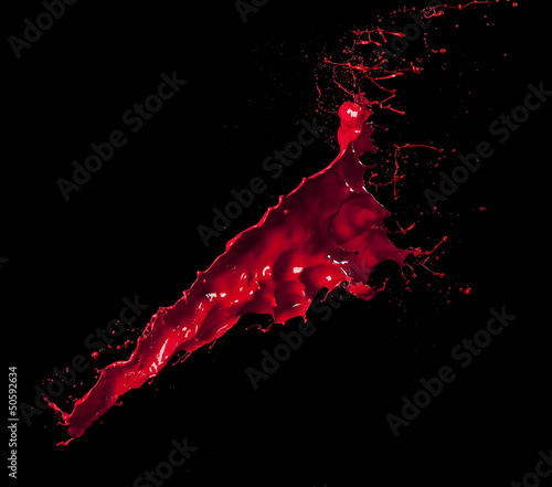 Photo: splashes of red paint isolated on black background splashes of red paint isolated on black background