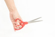 Sewing scissors in hand isolated on white