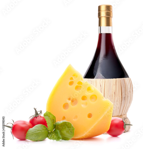 Photo: Red wine bottle, cheese and tomato still life Red wine bottle, cheese and tomato still life