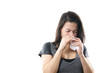 young woman blowing nose with paper tissue