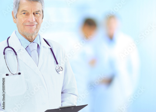 Photo: Portrait of friendly male doctor smiling Portrait of friendly male doctor smiling