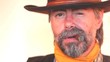 Closeup portrait of cowboy smoking cigar