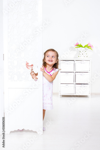 Photo: Hiding behind shutters Hiding behind shutters