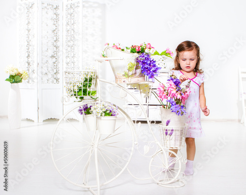 Photo: Girl playing with flowers Girl playing with flowers