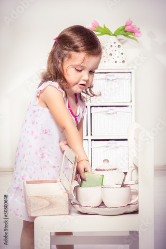 Photo: Girl making tea Girl making tea