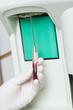 Woman performin hematological test.