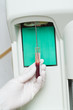 Woman performin hematological test.