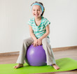 little girl doing gymnastic exercises