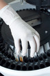 Woman loading samples in analyzer
