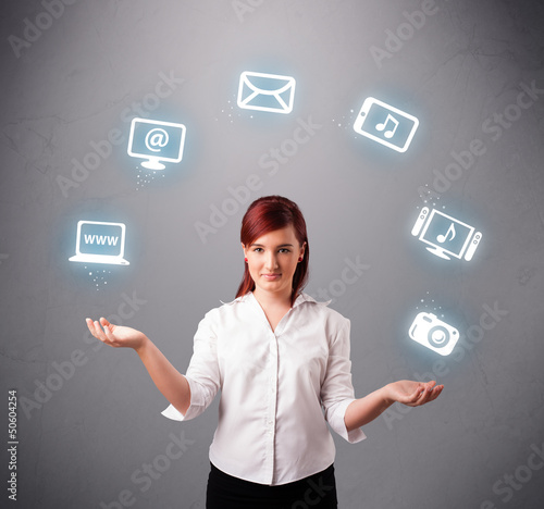Photo: pretty girl juggling with elecrtonic devices icons pretty girl juggling with elecrtonic devices icons